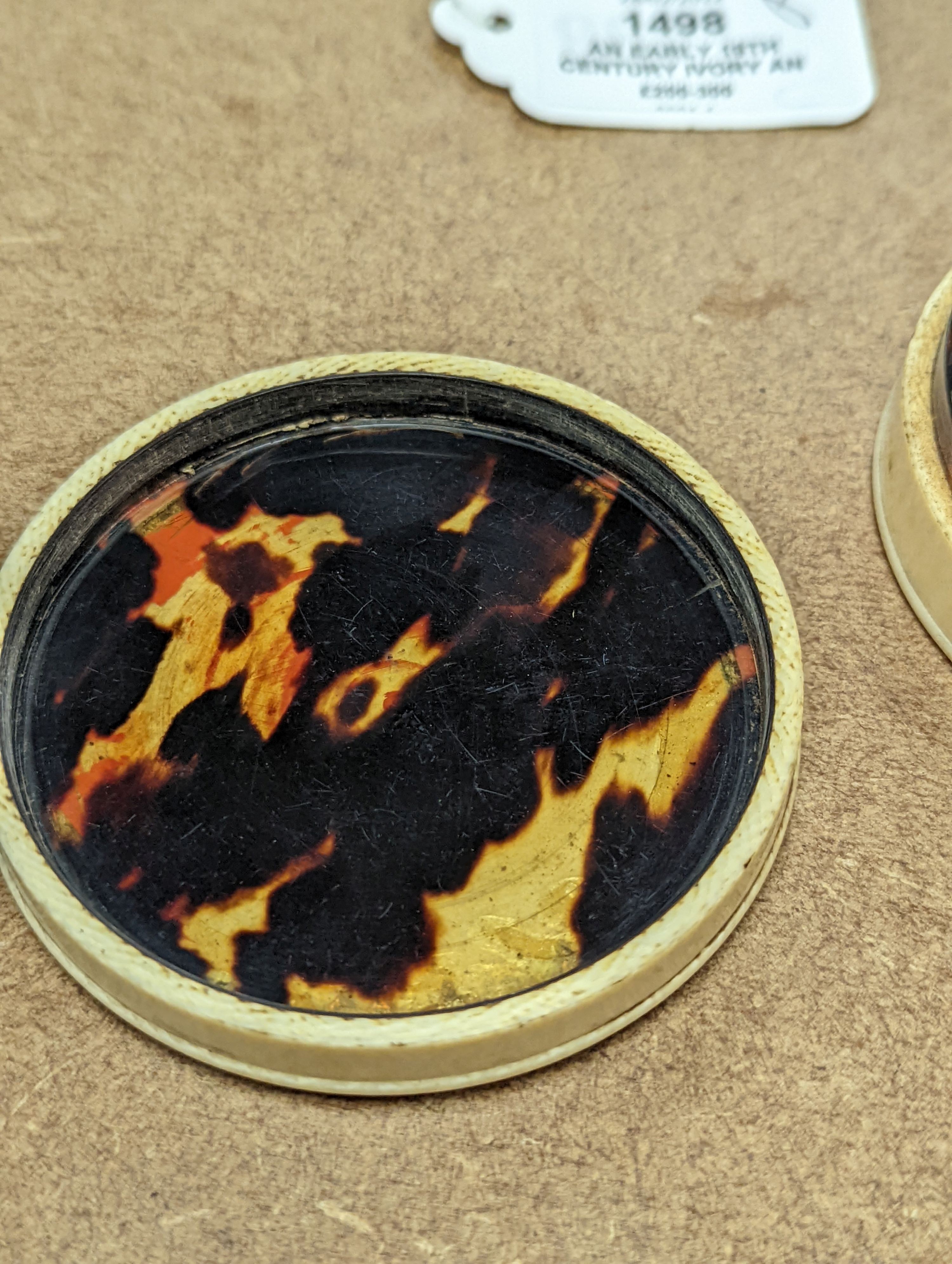 An early 19th century ivory and tortoishell box with inset miniature of Themis to cover, 8cm.